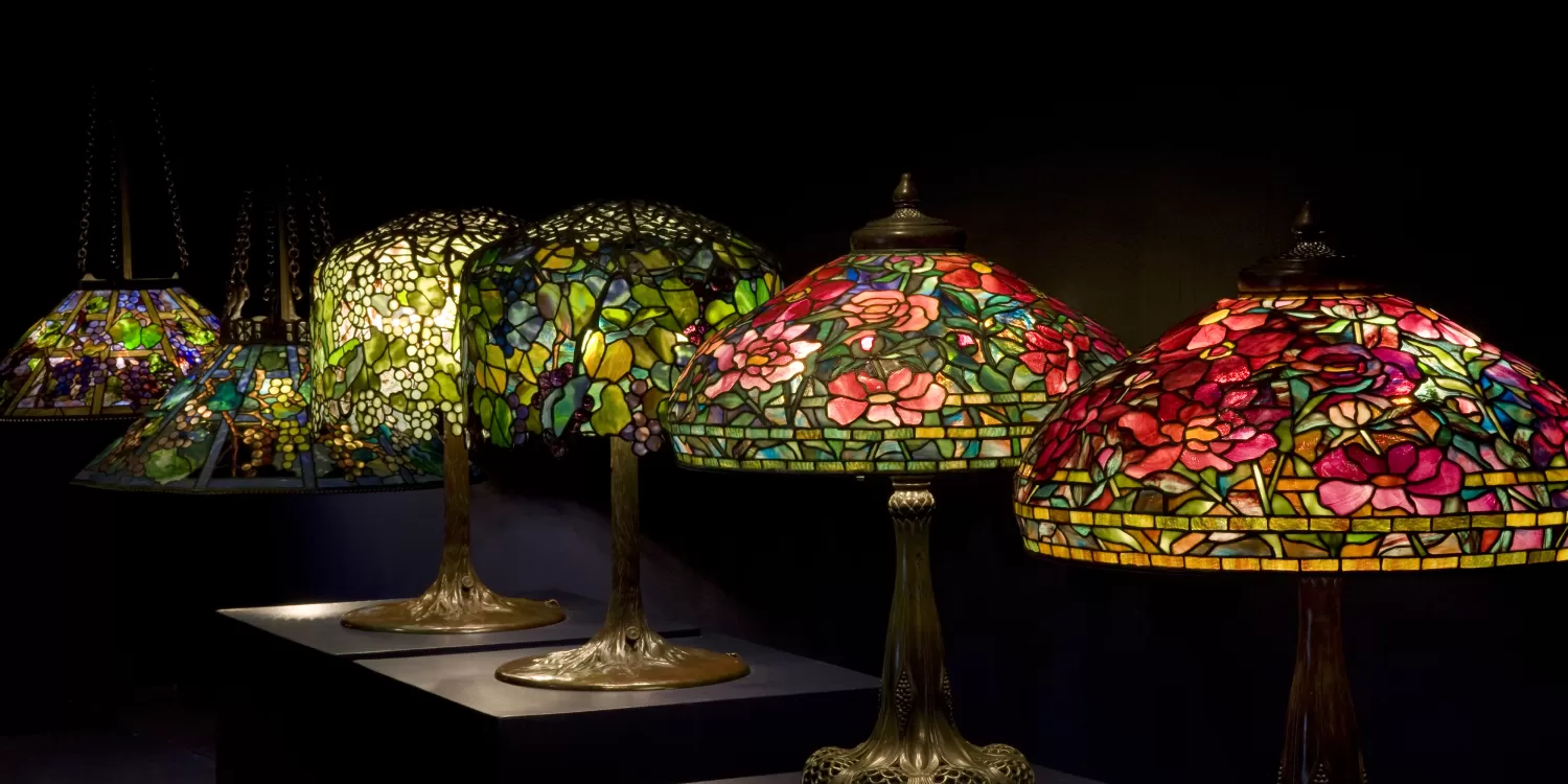 Tiffany stained glass lamps arranged in a row