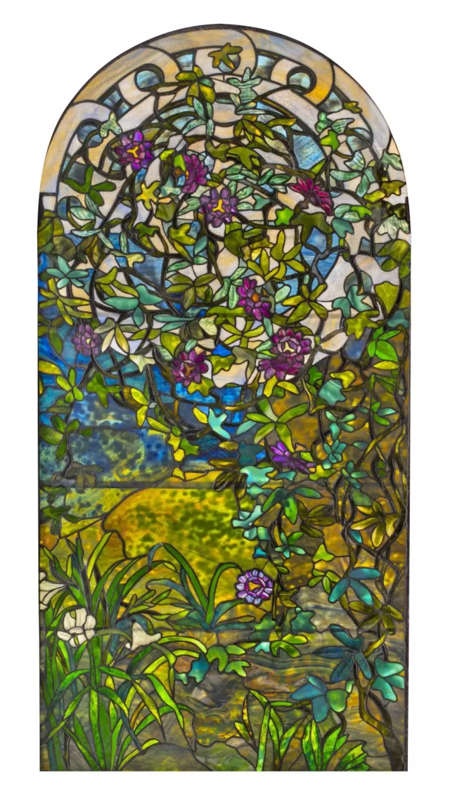 Vertical Tiffany glass window with lilies and passion flowers