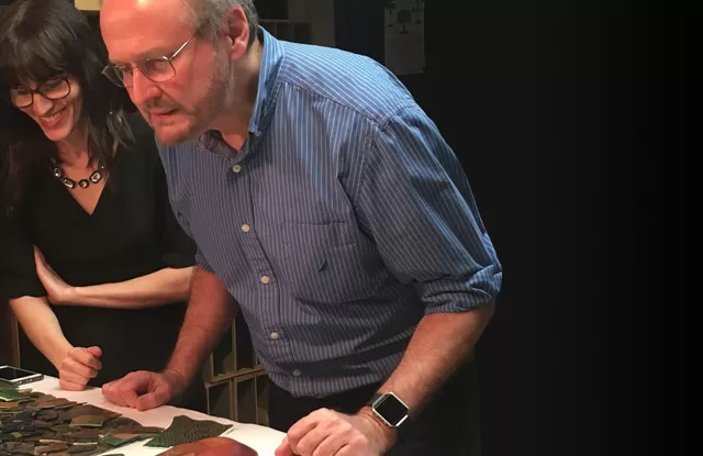 Gregory Merkel examining iridescent "jewels" at The Neustadt with Lindsy Parrott in the background