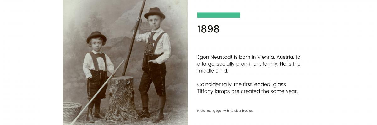 1898: Egon Neustadt is born in Vienna, Austria, to a large, socially prominent family. He is the middle child. Coincidentally, the first leaded-glass Tiffany lamps are created the same year.